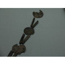 Part of an ornament with the sun symbol on each circle sheet